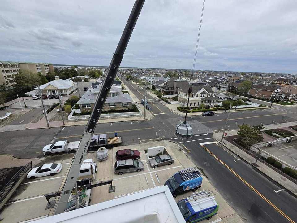 Cooling-tower piece headed toward a coastal rooftop