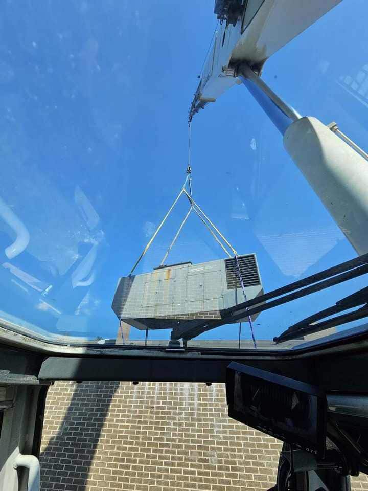 HVAC unit on the hook, shot from the operator cab