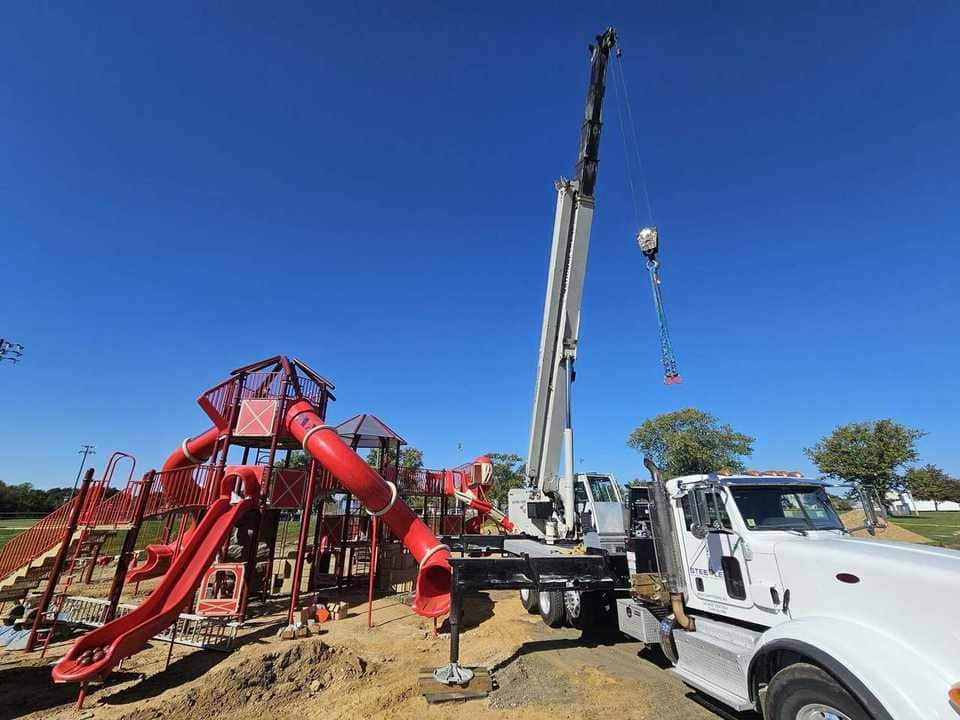 Playground structure lift and placement with truck-crane support