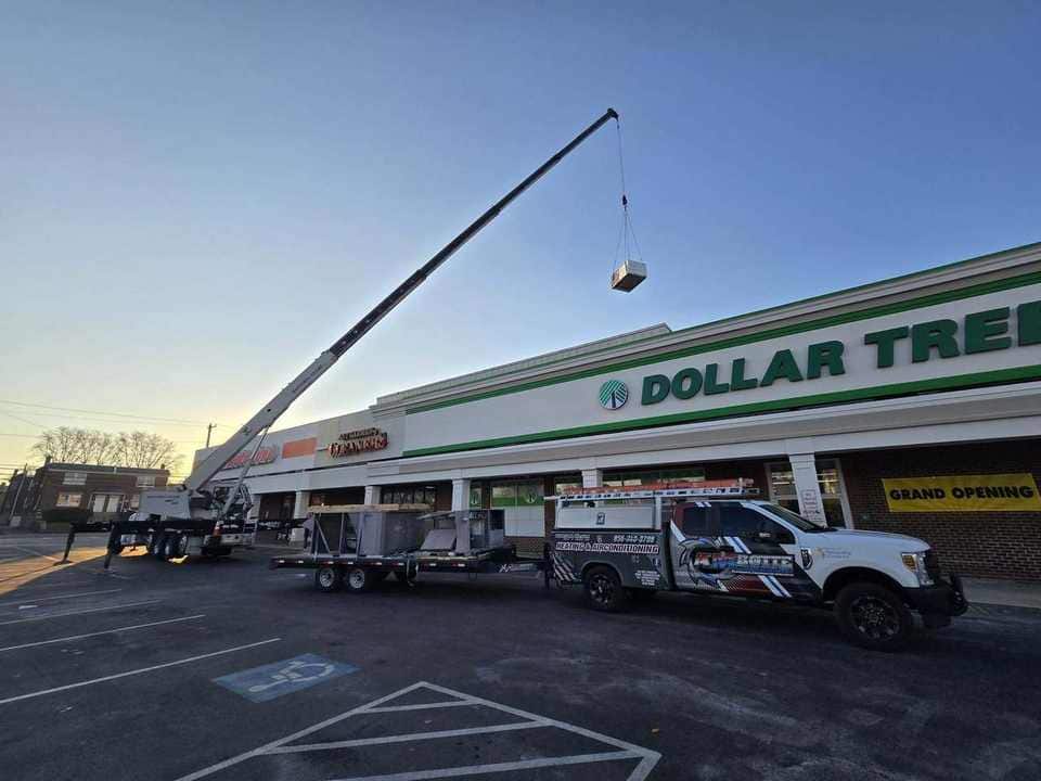Retail rooftop HVAC unit lifted into place
