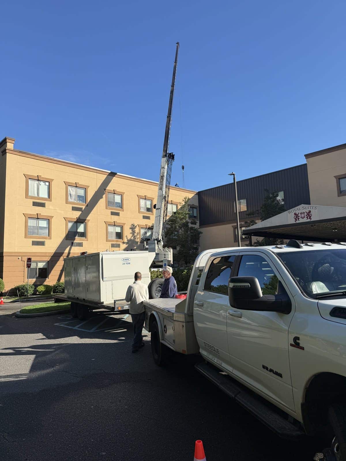Steedle truck crane and AAON RTU on a trailer at a healthcare facility in Galloway, NJ