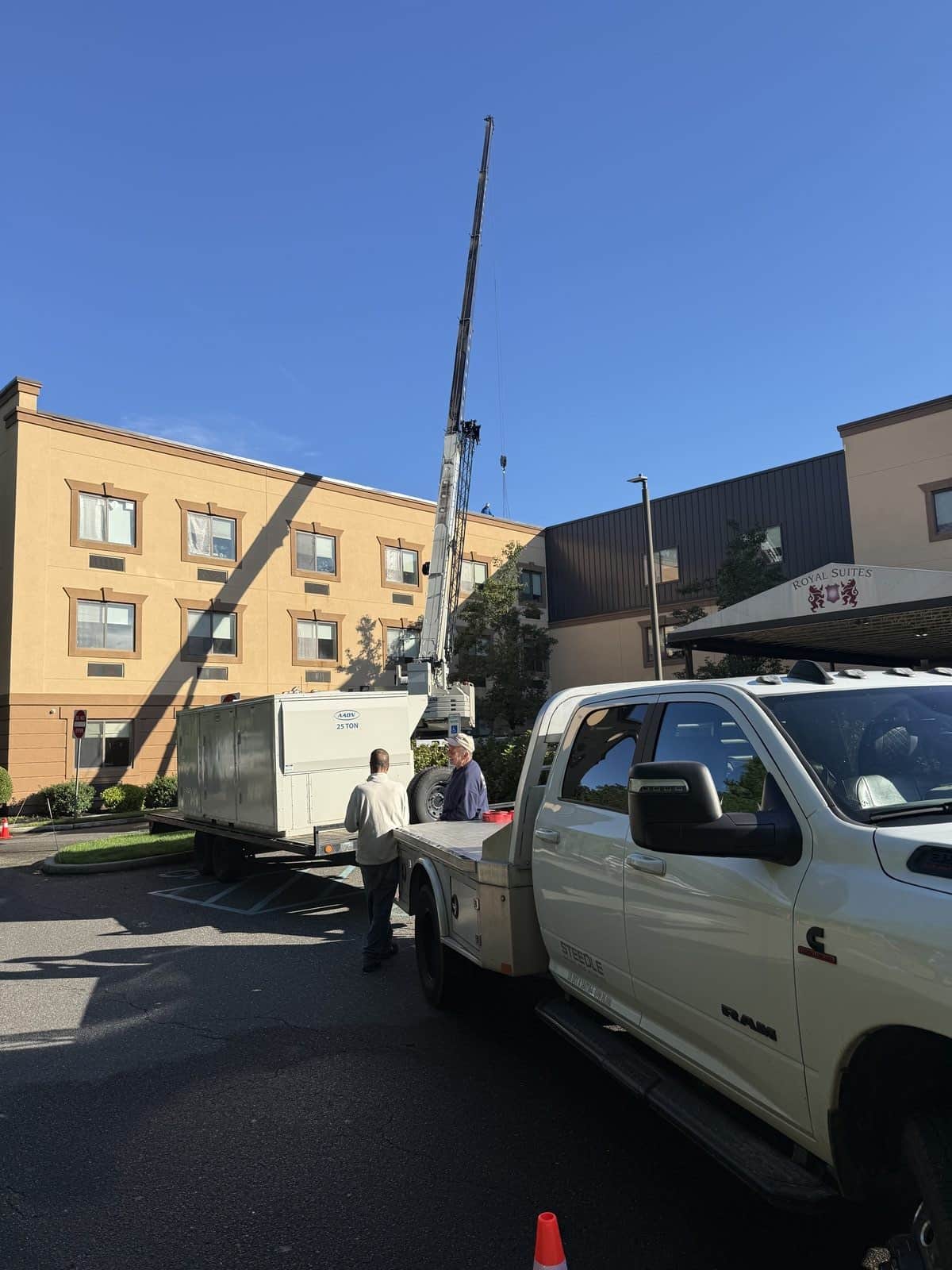 Steedle truck crane and AAON RTU on a trailer at a healthcare facility in Galloway, NJ