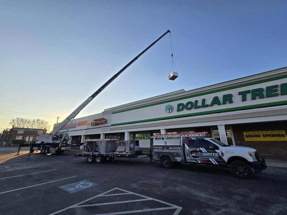 Retail rooftop HVAC unit lifted into place
