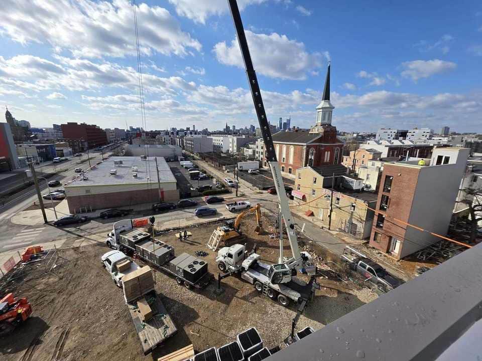 Crane working near an urban institutional jobsite