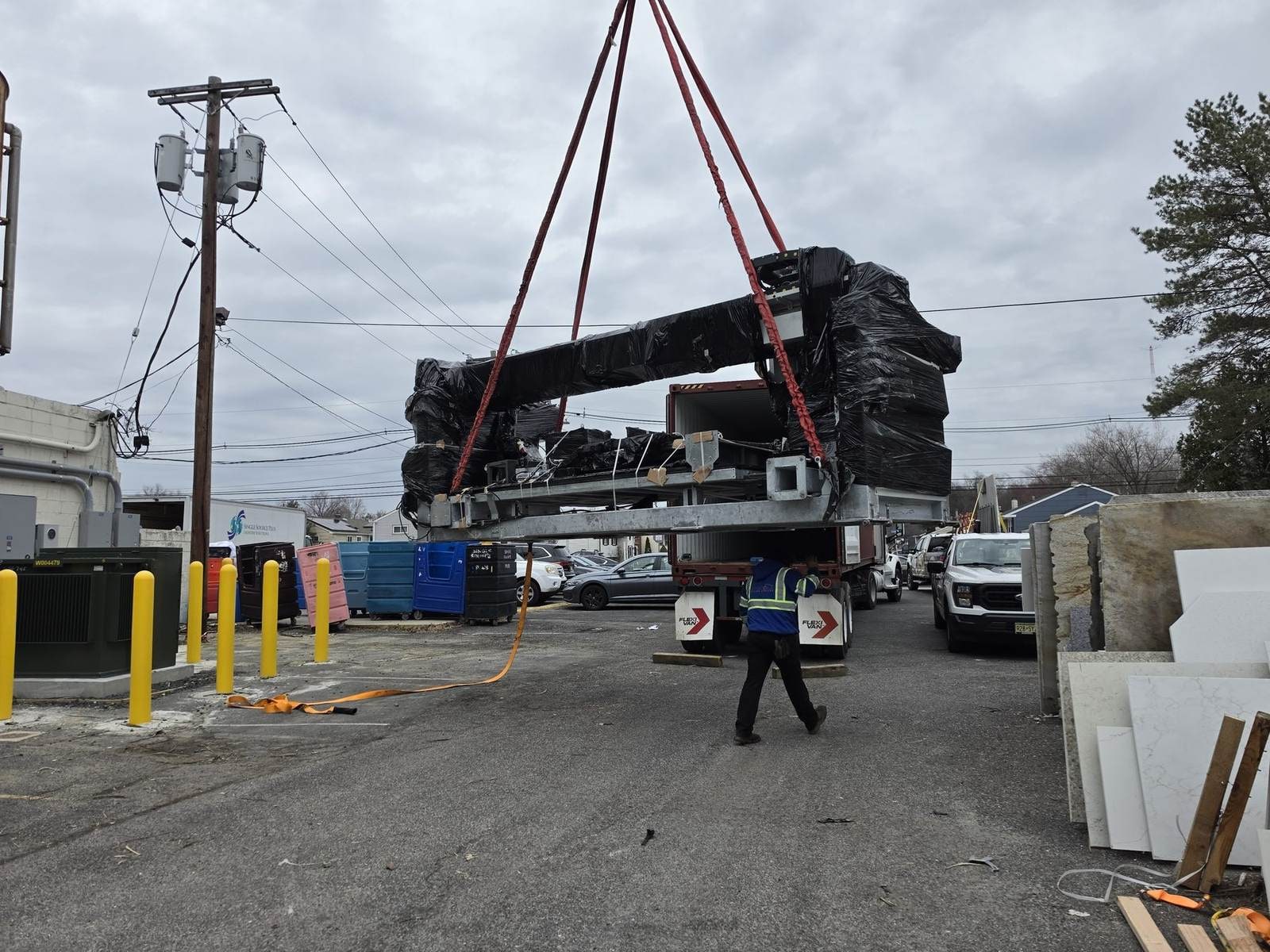 HVAC unit being lifted for change-out or disposal